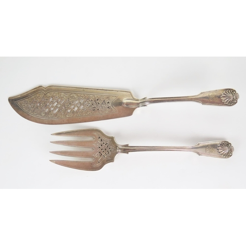 542 - A pair of Queen Victorian silver fish servers, fiddle thread and shell pattern, engraved crest of a ... 