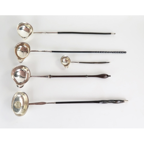 551 - A George III silver and fruitwood toddy ladle, London 1848, together with three large and one small,... 