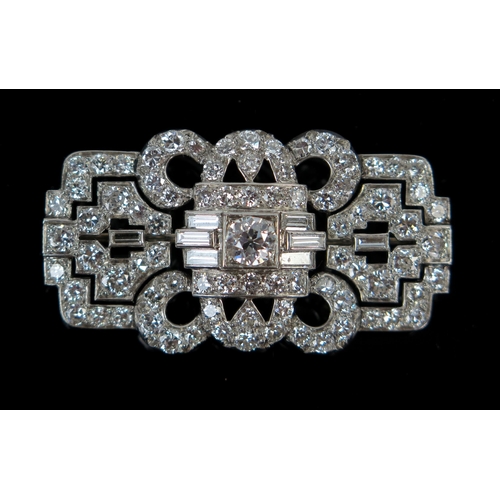 56 - Art Deco Diamond Brooch set with round and baguette cut stones in an unmarked platinum? setting, 42x...