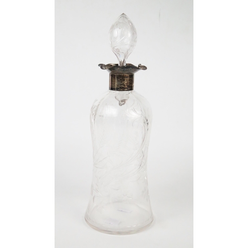 580 - An Edwardian carved glass and silver whiskey decanter and stopper, of wasted bottle form,  Birmingha... 