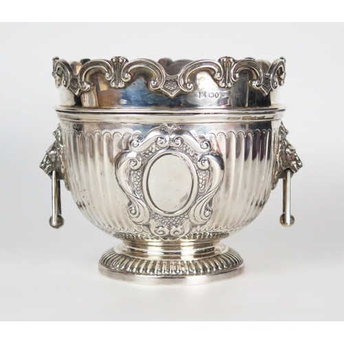 588 - A Victorian silver wine cooler, of small size, with triangular drop handles, the central cartouche e... 