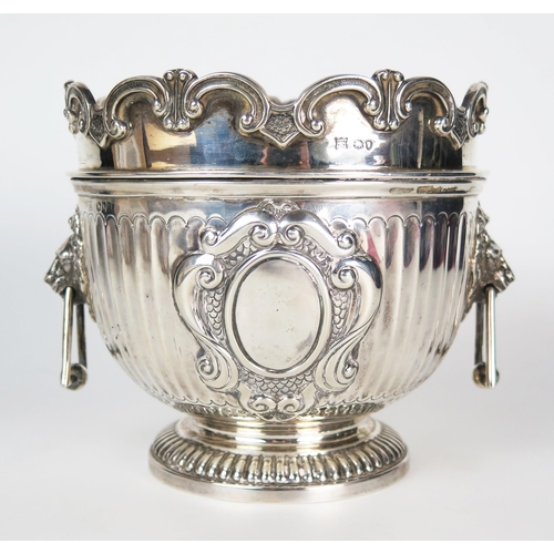 588 - A Victorian silver wine cooler, of small size, with triangular drop handles, the central cartouche e... 