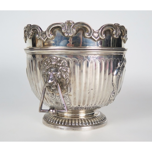 588 - A Victorian silver wine cooler, of small size, with triangular drop handles, the central cartouche e... 