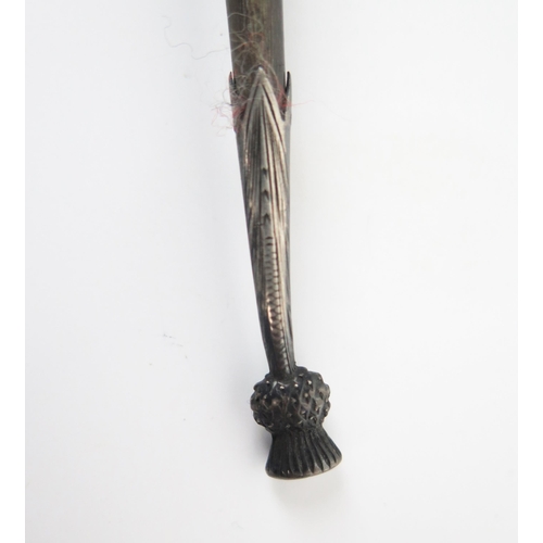 596 - Scottish interest, a horn and silver spoon, with a thistle finial, 16.5cm.