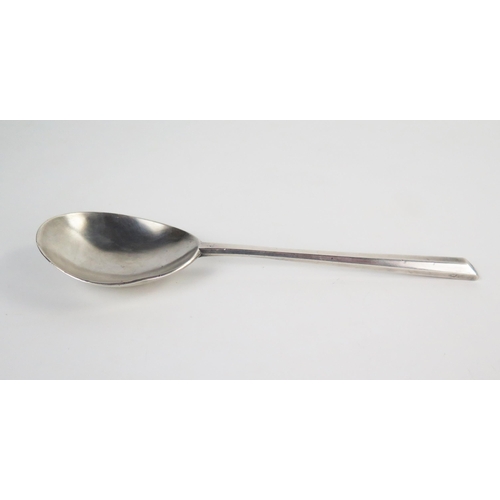 601 - A white metal spoon in the Elizabethan style, 18.5cm.