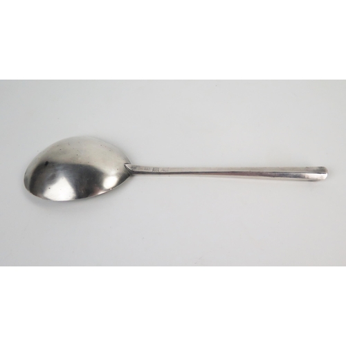 601 - A white metal spoon in the Elizabethan style, 18.5cm.