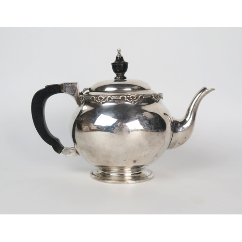 607 - An Arts and Crafts silver teapot, of bullet shape, with ebonised handle and finial, 15cm high, 428gr... 