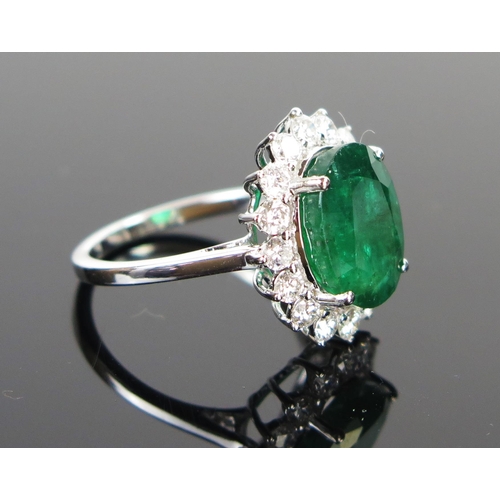 61 - Modern 18ct White Gold, Emerald and Diamond Cluster Ring, size N, 4.6g. Central stone c. 12x9.3mm, 1... 