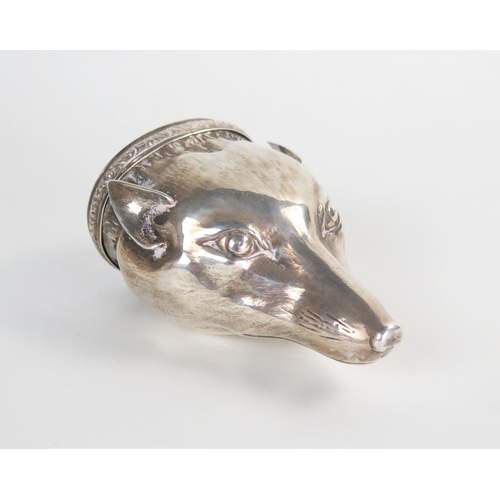 610 - An early 19th Century silver fox head snuff box, raised chased and engraved, engine turned oval lid ... 