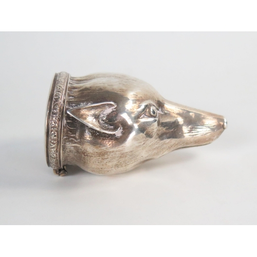 610 - An early 19th Century silver fox head snuff box, raised chased and engraved, engine turned oval lid ... 