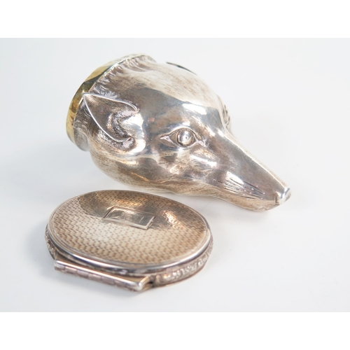 610 - An early 19th Century silver fox head snuff box, raised chased and engraved, engine turned oval lid ... 