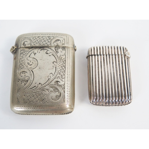 614 - An George V silver vesta case, with reeded decoration, Birmingham 1915, 10grams, together with a nic... 