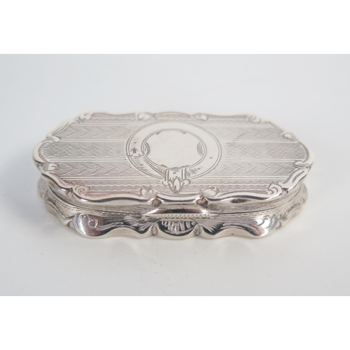 616 - A Victorian silver vinaigrette, oblong form, engine turned decoration, Rococo Revival, Birmingham 18... 