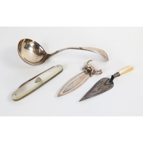 617 - A George V silver novelty book mark in the form of a trowel, together with a sterling silver cat boo... 