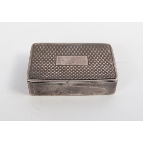 619 - A small silver pill case, of rectangular form, engine turned,  London 1904, 3cm.