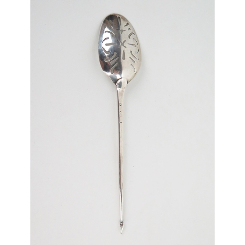 630 - An 18th Century silver mote spoon, with pierced bowl, slender tapering stem, mitre terminal, marks r... 