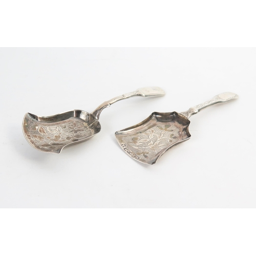 646 - A George IV silver caddy spoon, Birmingham 1824, Thomas Millington, together with another Birmingham... 