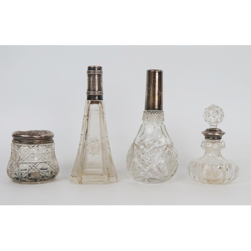 662 - Four silver and glass dressing table bottle, (4). stoppers missing, marks worn.