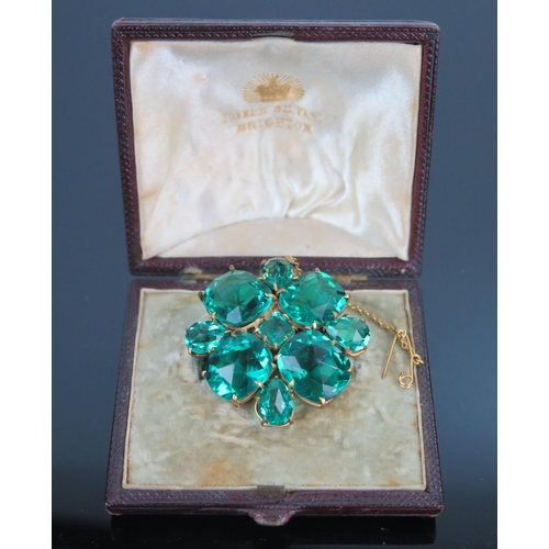 67 - Green Paste Brooch in a gold plated setting, c. 38mm wide, boxed