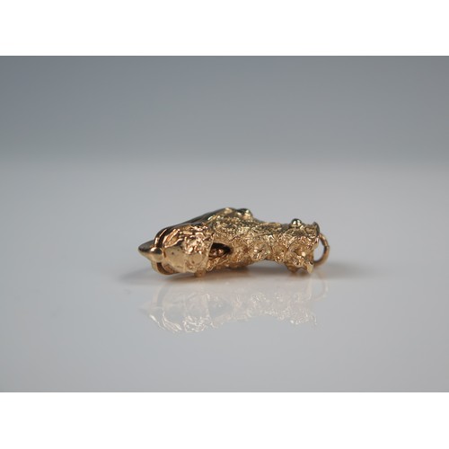 145 - 9ct Gold Charm in the form of an ice skating boot with hinged heel opening to reveal a female ice sk... 