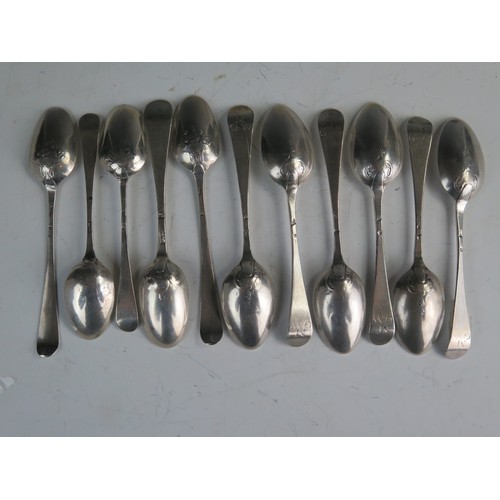 573 - A matched set of eleven Georgian silver teaspoons, Old English Pattern, engraved initials, decorated... 