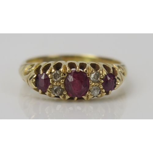 10 - Ruby and Old Cut Diamond Ring in an 18ct gold setting, central stone 4.7x4.1mm, size M.25, 4.4g