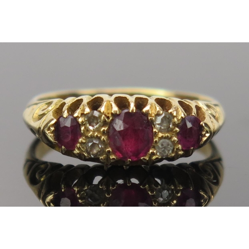 10 - Ruby and Old Cut Diamond Ring in an 18ct gold setting, central stone 4.7x4.1mm, size M.25, 4.4g