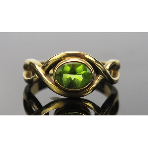 11 - Peridot Dress Ring in an unmarked gold setting, size O.5, 4.8g