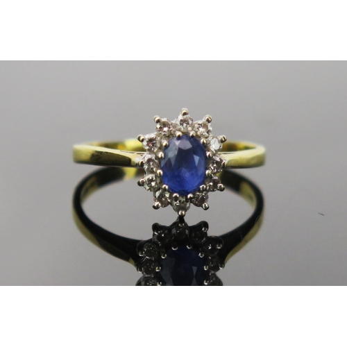 12 - Sapphire and Diamond Cluster Ring in an 18ct hallmarked setting, 11x9mm head, size P.5, 3.1g