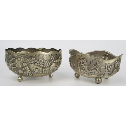 131 - Set of Two Indian White Metal Shaped Oval Dishes with embossed decoration, largest 11x9.5cm, 191g