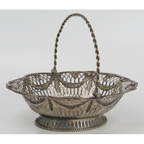 134 - George III Silver Swing Handled Oval Basket with foliate swag decoration (15x13cm, London 1774, Chas... 