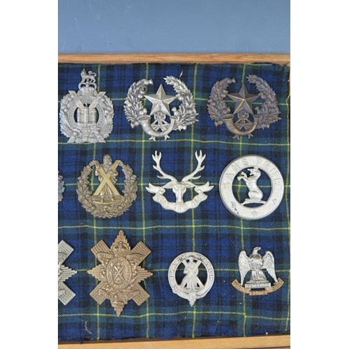 145 - Collection of Military Helmet and Cap badges including The Royal Scots, Black Watch, King's Own Scot... 