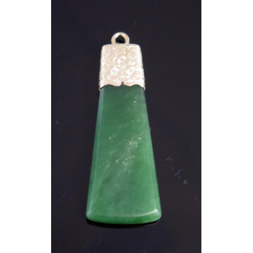 15 - Antique Nephrite Axe Shaped Pendant in an unmarked gold setting with chased foliate decoration, 51.5... 