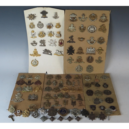 169 - Large Selection of Military Cap Badges including Monmouth Regiment of Welsh Guards, 1st Royal Devon ... 