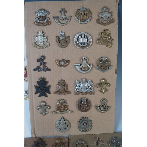 169 - Large Selection of Military Cap Badges including Monmouth Regiment of Welsh Guards, 1st Royal Devon ... 