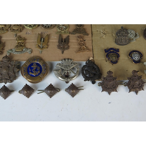 169 - Large Selection of Military Cap Badges including Monmouth Regiment of Welsh Guards, 1st Royal Devon ... 