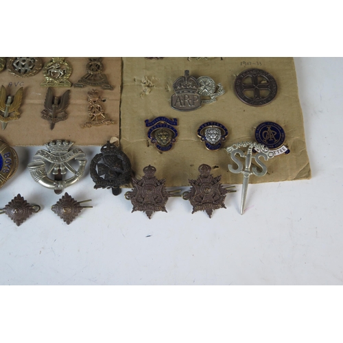 169 - Large Selection of Military Cap Badges including Monmouth Regiment of Welsh Guards, 1st Royal Devon ... 