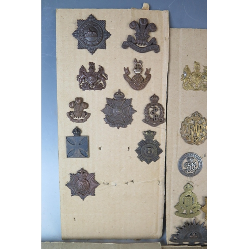 171 - Collection of Military Cap Badges including R.N.D., Royal Marines, Navy, Scottish King's Borderers, ... 