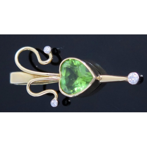 18 - Peridot and Diamond Pendant in an 18ct hallmarked gold setting, 34.5mm drop, 4.2g