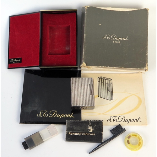 184 - S. J. Dupont Cased Silver Lighter, numbered to the base E F 4026, sold with box and papers. Flint wh... 