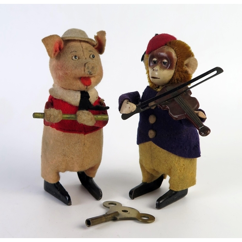 189 - Schuco Clockwork Pig playing a penny whistle and monkey playing a fiddle, c. 12cm high