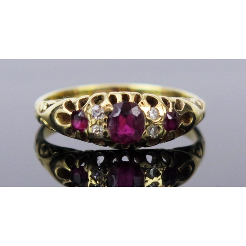 19 - Ruby and Old Cut Diamond Ring in an 18ct stamped gold setting, c. 4.9x4.2mm central stone, size P.75... 