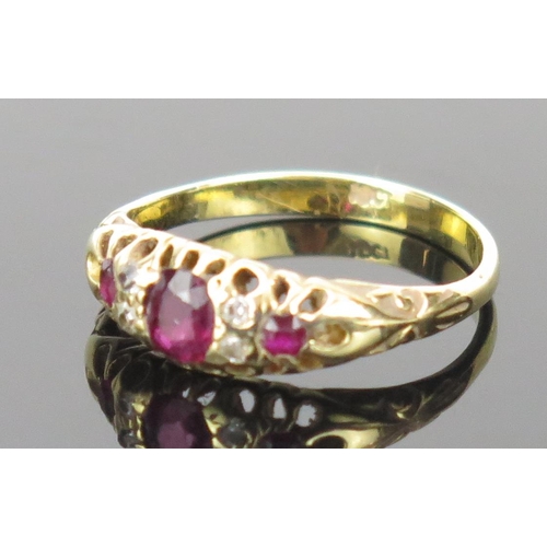 19 - Ruby and Old Cut Diamond Ring in an 18ct stamped gold setting, c. 4.9x4.2mm central stone, size P.75... 