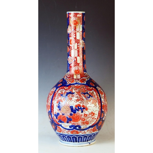 232 - Japanese Meiji Period Imari vase  of bottle form, decorated with garden scenes, 51cm 20 1/4inches.