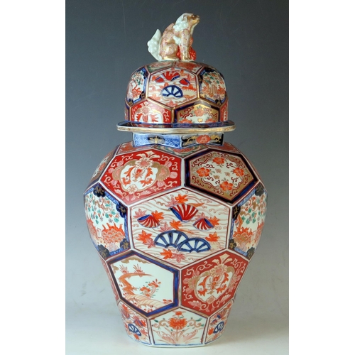 233 - Japanese Imari Pattern Lidded Vase, co-joined octagonal  panels decorated with garden scenes in unde... 