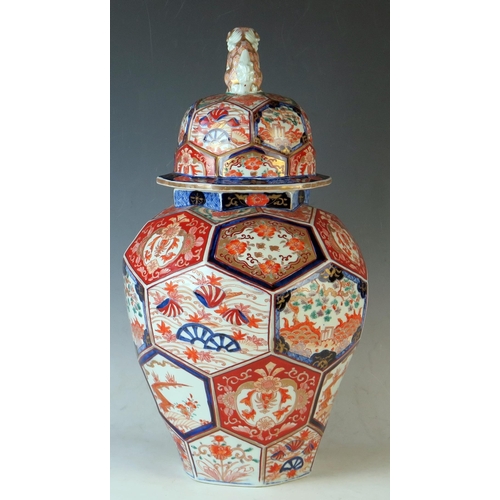 233 - Japanese Imari Pattern Lidded Vase, co-joined octagonal  panels decorated with garden scenes in unde... 