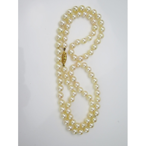 24 - Cultured Pearl Necklace with a hallmarked 9ct gold clasp, pearls c. 7mm, 37.7g