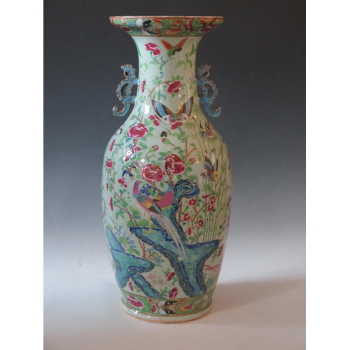 244 - Large Chinese Famille Rose Vase, the central decoration depicts figures collecting butterflies and i... 