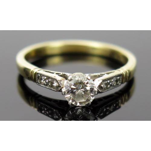 28 - Diamond Solitaire Ring in a platinum setting with two chip diamonds to each shoulder, EDW .5ct, size... 