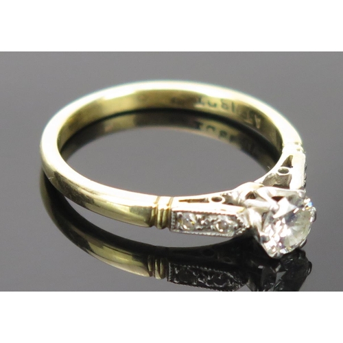 28 - Diamond Solitaire Ring in a platinum setting with two chip diamonds to each shoulder, EDW .5ct, size... 